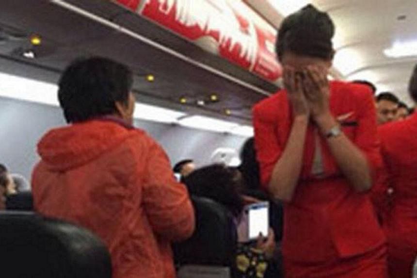 Chinese state-run media branded four unruly air passengers "barbarians" on Monday after they scalded an air hostess and threatened to blow up a plane in a dispute over seating. -- PHOTO: STOMP