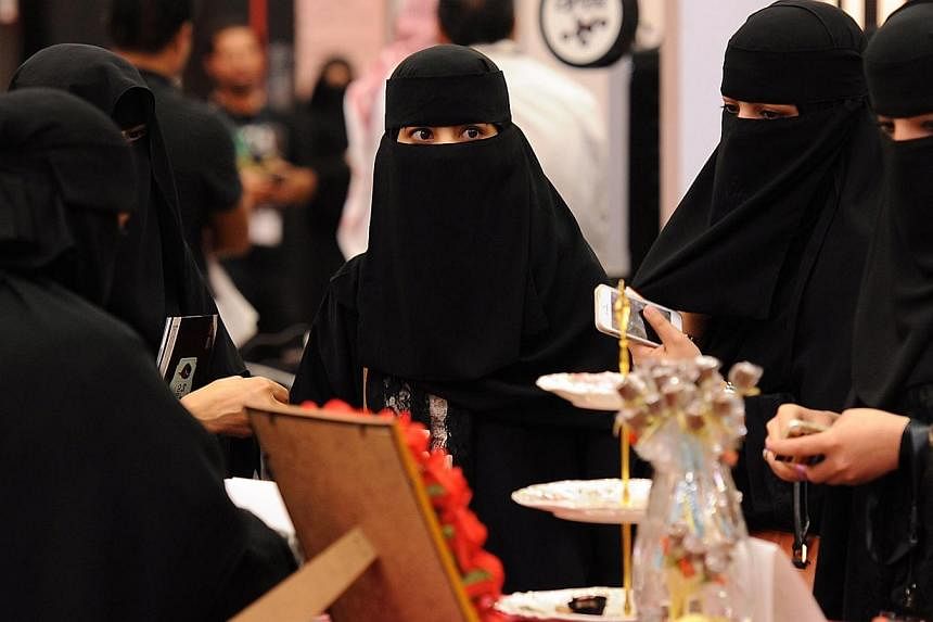 A Saudi cleric has sparked uproar by appearing on television along with his wife - whose face was uncovered in an open challenge to strict tradition in the ultra-conservative Muslim kingdom. -- PHOTO: AFP