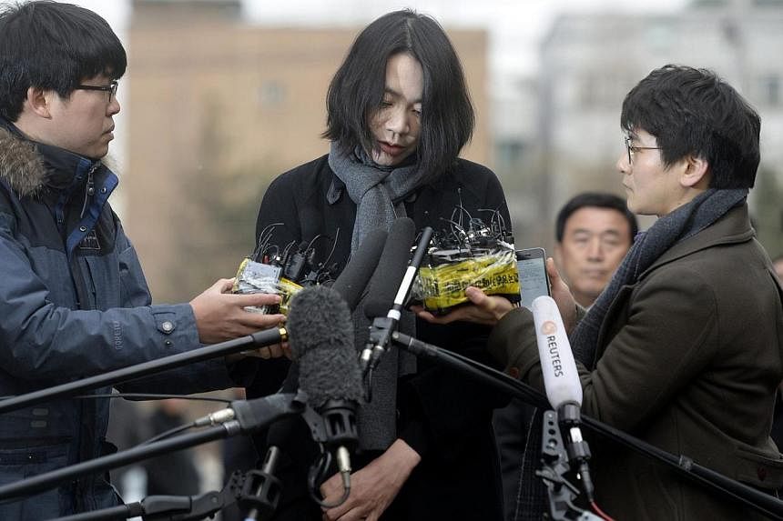 Former executive Heather Cho, daughter of Korean Air Lines chairman Cho Yang Ho, appears in front of the media outside the offices of the Aviation and Railway Accident Investigation Board of the Ministry of Land, Infrastructure, Transport, in Seoul o