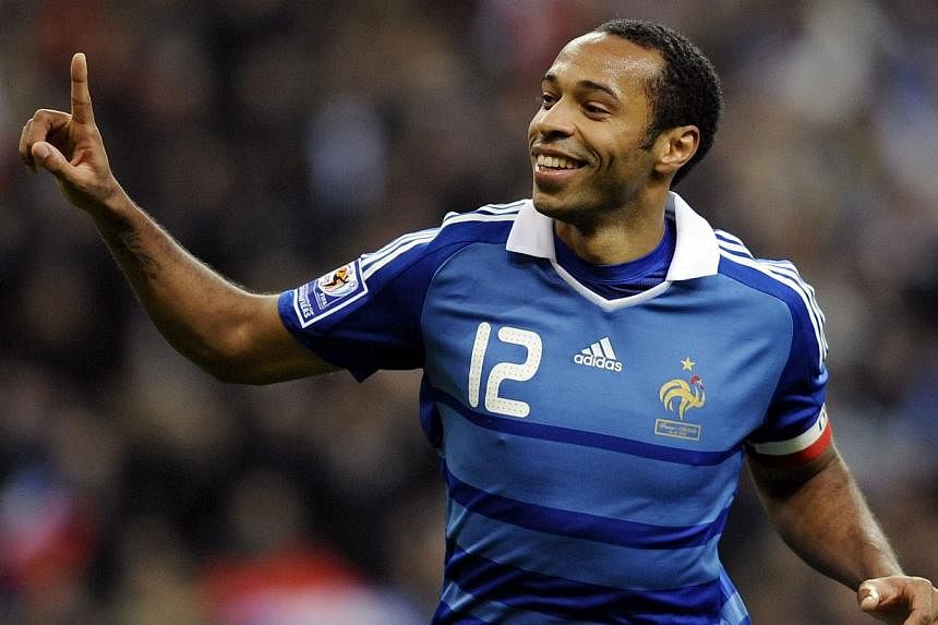 Present-day Arsenal stars led the tributes to club great Thierry Henry (above) on Tuesday after the former France striker announced his retirement from professional football. -- PHOTO: AFP