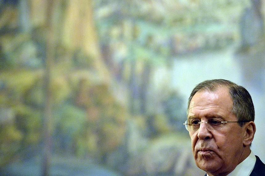 Russia's foreign minister Sergei Lavrov (above) said on Tuesday he had "very serious reasons" to think Western sanctions were an attempt to force regime change in Moscow. -- PHOTO: AFP