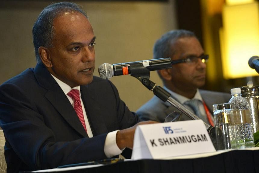 Minister for Law and Foreign Affairs K Shanmugam (left) said he had asked the Ministry of Law to review the framework for granting bail&nbsp;in light of the Sydney hostage situation on Dec 15, 2014.&nbsp;-- PHOTO: ST FILE