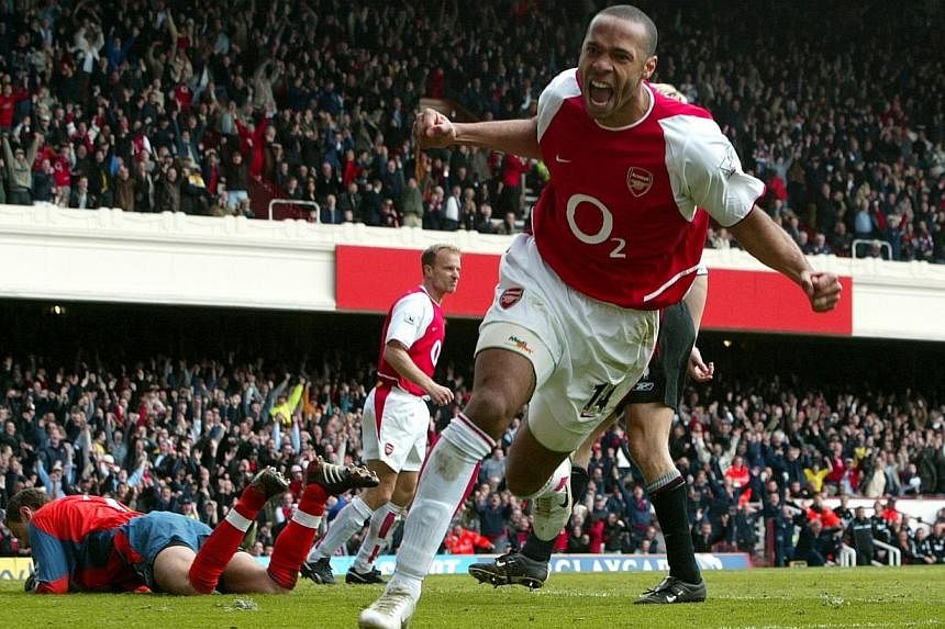 Thierry Henry celebrating scoring for Arsenal against Liverpool at Highbury in 2004. -- PHOTO: ACTION IMAGES
