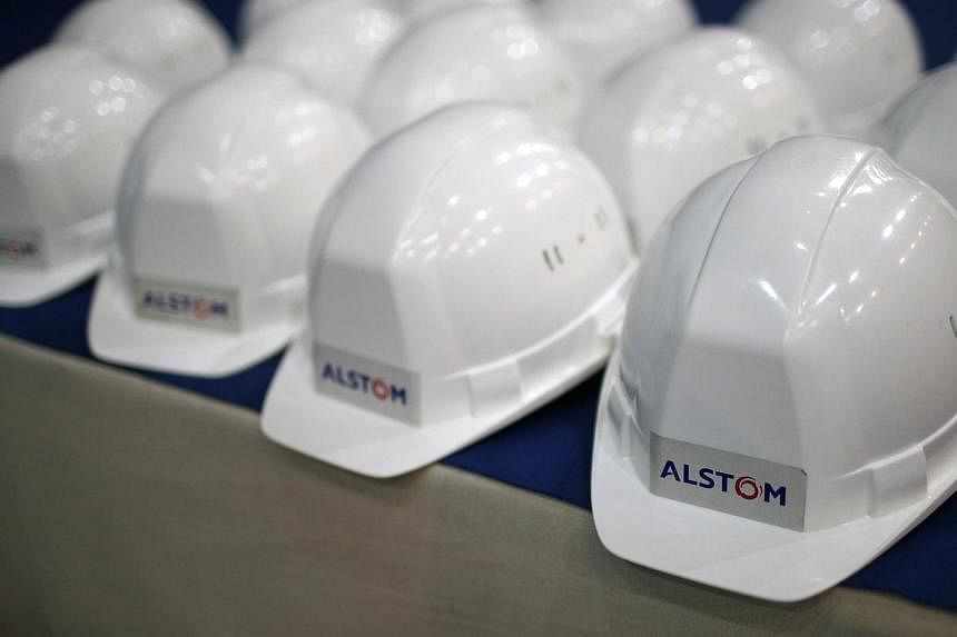 French industrial giant Alstom has agreed to pay US$700 million (S$911 million) to settle US corruption charges related to bribes in Indonesia and other countries, a person familiar with the matter said Tuesday. -- PHOTO: REUTERS