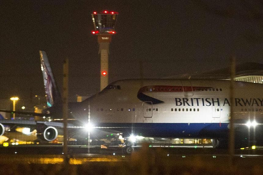 Aircraft taxi next to the control tower at Heathrow airport in London, Dec 12, 2014.&nbsp;London police stopped a plane on the runway at Heathrow Airport to remove a 15-year-old girl intent on joining Islamist fighters in Syria, a report said Wednesd