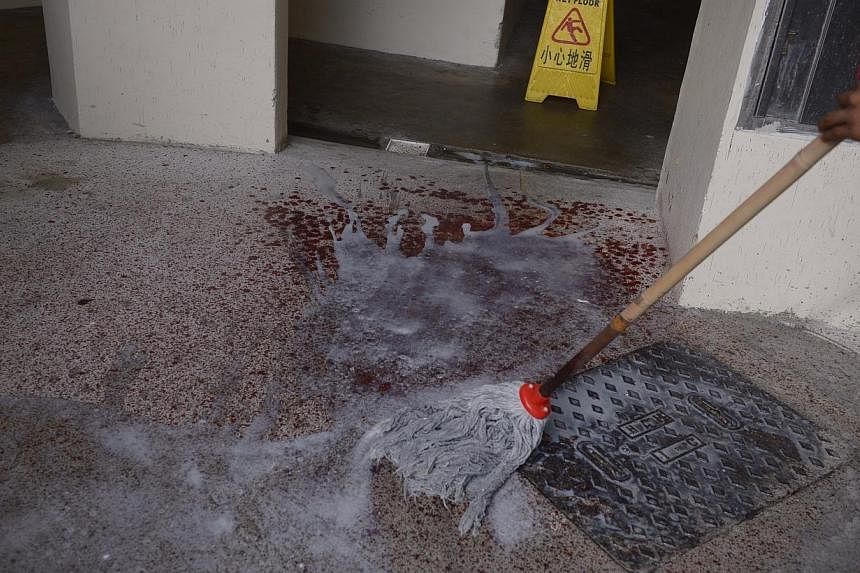 The blood trail, at Blk 505 Tampines Central 1, left by the fleeing suspect. -- ST PHOTO: MARK CHEONG&nbsp;