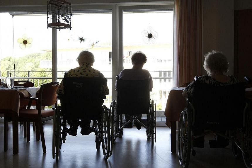 Pensioners in wheelchairs are silhouetted at a residential home for the elderly in Eichenau, near Munich, Germany, in a 201 photo. Health researchers say life expectancy is rising almost everywhere in the world, except southern sub-Saharan Africa. --
