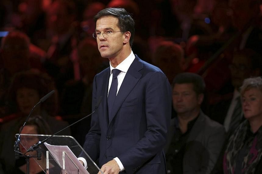 Dutch Prime Minister Mark Rutte makes a speech during a national memorial for the victims of the Malaysian Airlines MH17, at the RAI Convention Centre in Amsterdam on Nov 10, 2014. Mr Rutte cancelled a trip to Brussels, where he was due to take part 