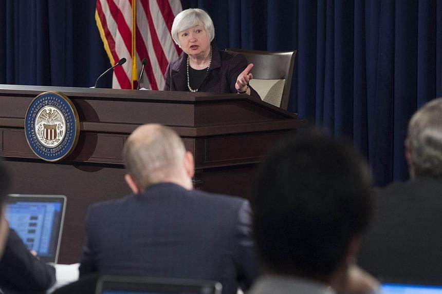 Fed Chair Janet Yellen holds a press conference at the Federal Reserve Board on Dec 17, 2014 in Washington,DC.&nbsp;Since the United States Federal Reserve issued comments on Thursday night about its plans for upcoming monetary policy, analysts and e