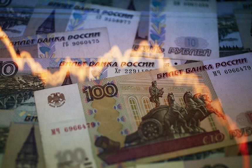 Russia's rouble strengthened on Wednesday after dramatic falls against the US dollar in the previous two days but remained extremely volatile and fears of a prolonged crisis remained. -- PHOTO: REUTERS