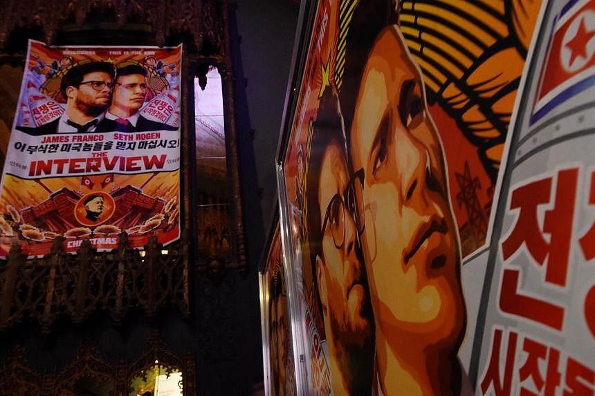 Movie posters for the premiere of the film The Interview at The Theatre at Ace Hotel in Los Angeles, California on Dec 11, 2014. -- PHOTO: AFP
