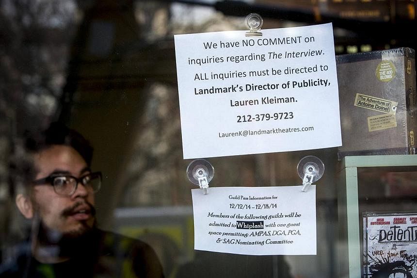 A sign is seen posted on the box office window at the Sunshine Cinema in New York Dec 17, 2014.&nbsp;US cinemas cancelled screenings, including a red-carpet New York premiere, of a madcap comedy that offended North Korea, after mysterious computer ha