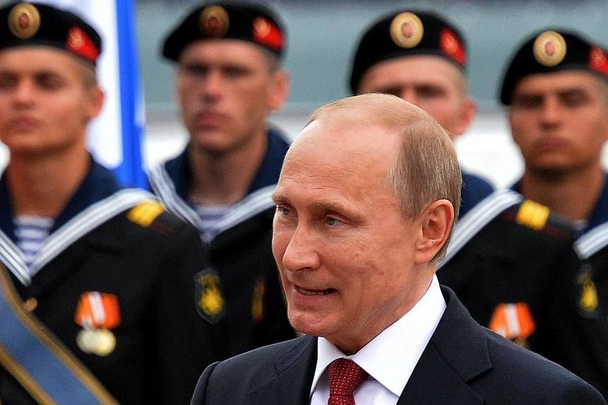 A file picture taken on May 9, 2014 shows Russian President Vladimir Putin as he speaks during his visit to the Crimean port of Sevastopol. -- PHOTO: AFP