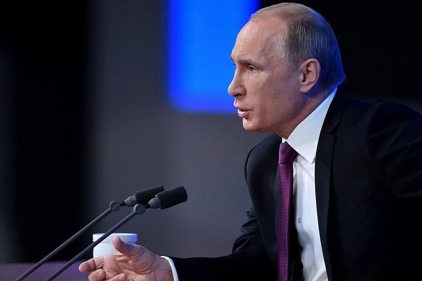 Russian President Vladimir Putin speaks during his annual press conference in Moscow on Dec 18, 2014. -- PHOTO: AFP