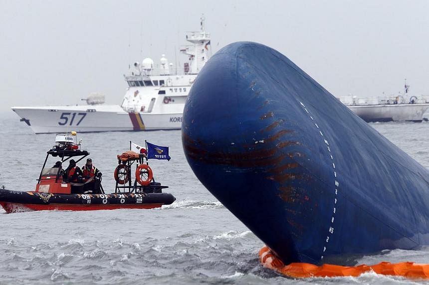 Rescue boats sail around the South Korean passenger ship 'Sewol' which sank, during their rescue operation in the sea off Jindo in this April 17, 2014 file photograph. -- PHOTO: REUTERS