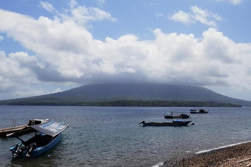 The volcano, Mount Gamalama - which forms the entire island of Ternate in North Maluku province - erupted late Thursday and was still coughing up ash the following day.&nbsp;-- ST PHOTO: ZAKIR HUSSAIN