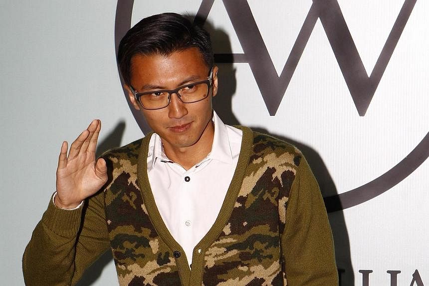 Nicholas Tse batted away talk that he is to wed lover Faye Wong, as the media questioned him if he planned to settle down in Beijing. -- PHOTO: APPLE DAILY