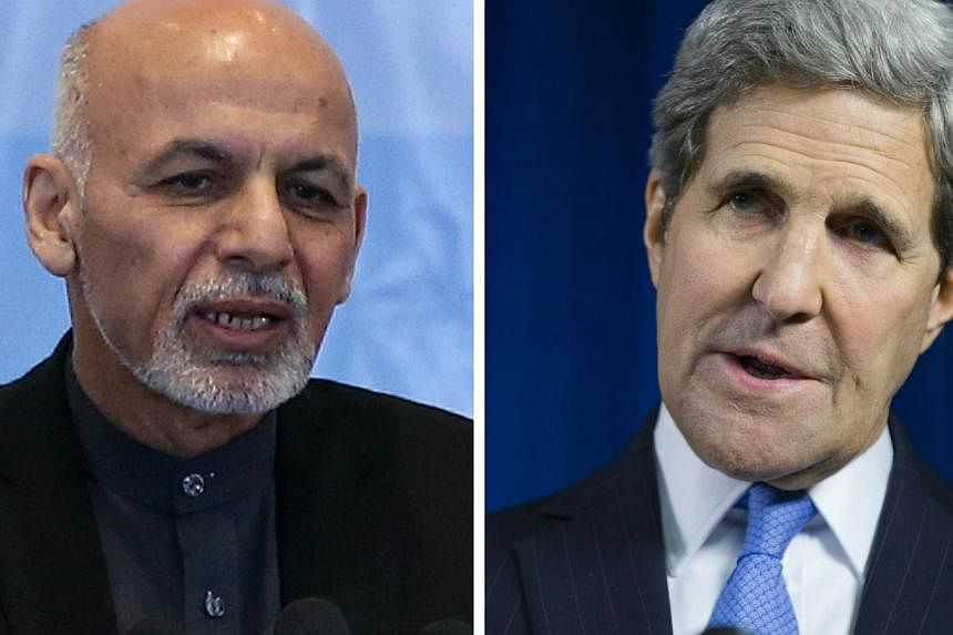 Afghan President Ashraf Ghani (left) and US Secretary of State John Kerry are among those with thankless political jobs, according to the writer. -- PHOTO: REUTERS