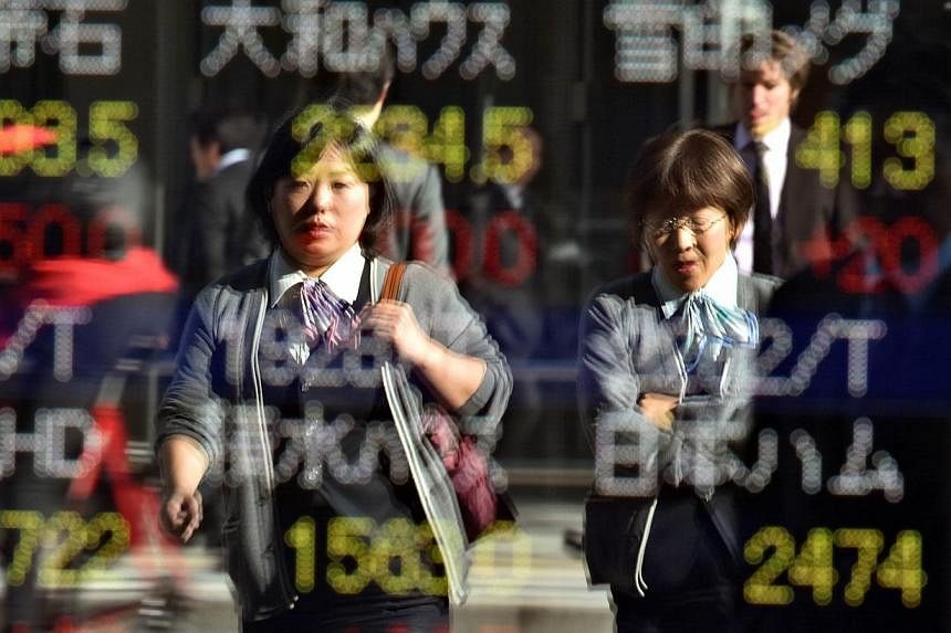 Japanese stocks led Asian markets higher on Friday, after Wall Street boasted its biggest two-day advance since late 2011. -- PHOTO: AFP