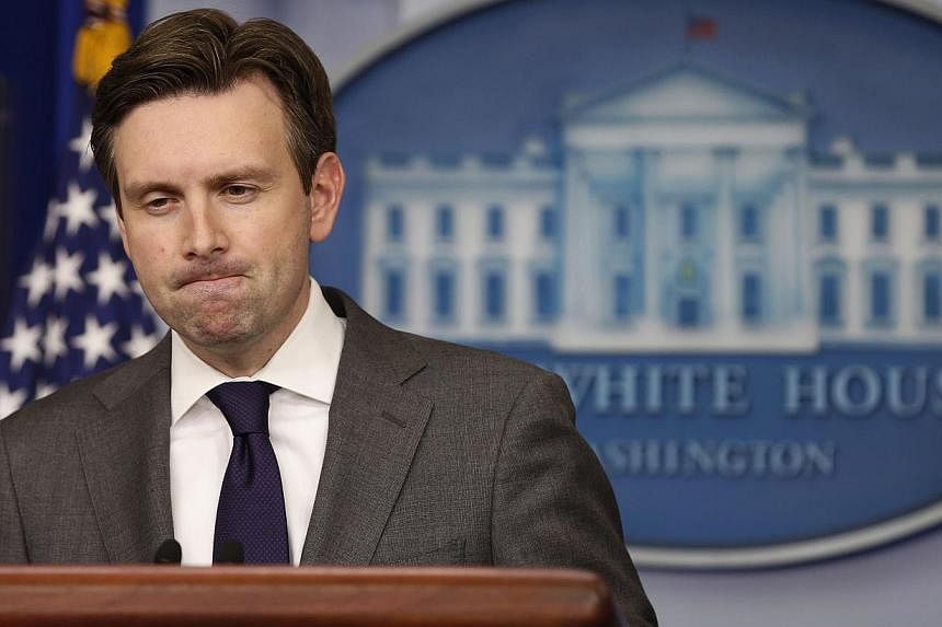 White House press secretary Josh Earnest pauses while answering a question about North Korea at the White House in Washington, Dec 18, 2014. Mr Earnest said he was not in a position to confirm North Korea was responsible for a cyber attack on Sony Pi