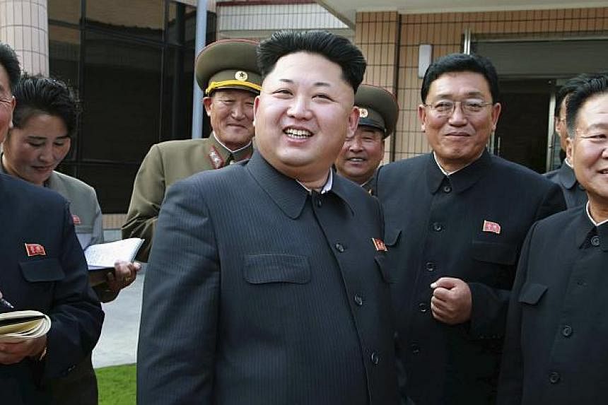North Korea leader Kim Jong Un is pictured (centre) in an&nbsp;undated photo released by North Korea's Korean Central News Agency in Pyongyang Oct 22, 2014.&nbsp;US determination that North Korea was behind the hacking of Sony Pictures again exposes 
