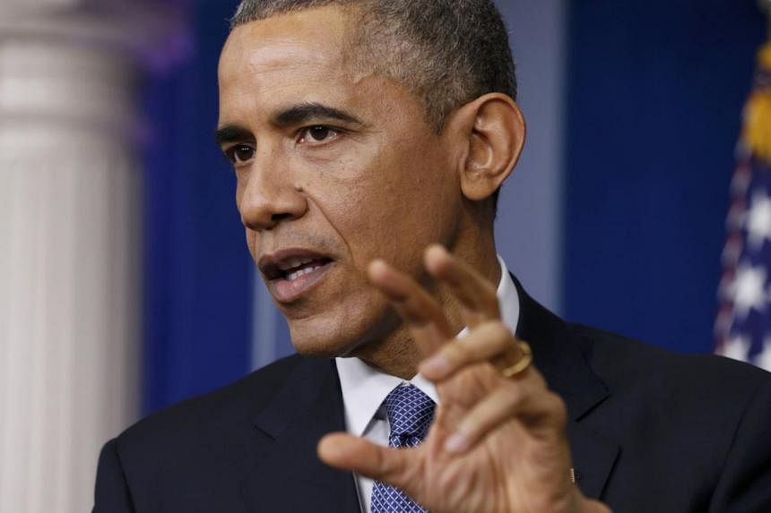 US President Barack Obama answers a question about the cyber attack on Sony Pictures after his end-of-year press conference in the briefing room of the White House in Washington, Dec 19, 2014. -- PHOTO: REUTERS