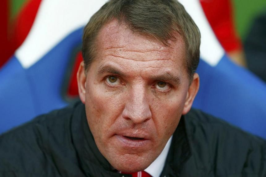 Brendan Rodgers (above) was in no mood to hang around as the under-pressure Liverpool manager made quick work of his weekly press conference on Friday. -- PHOTO: REUTERS