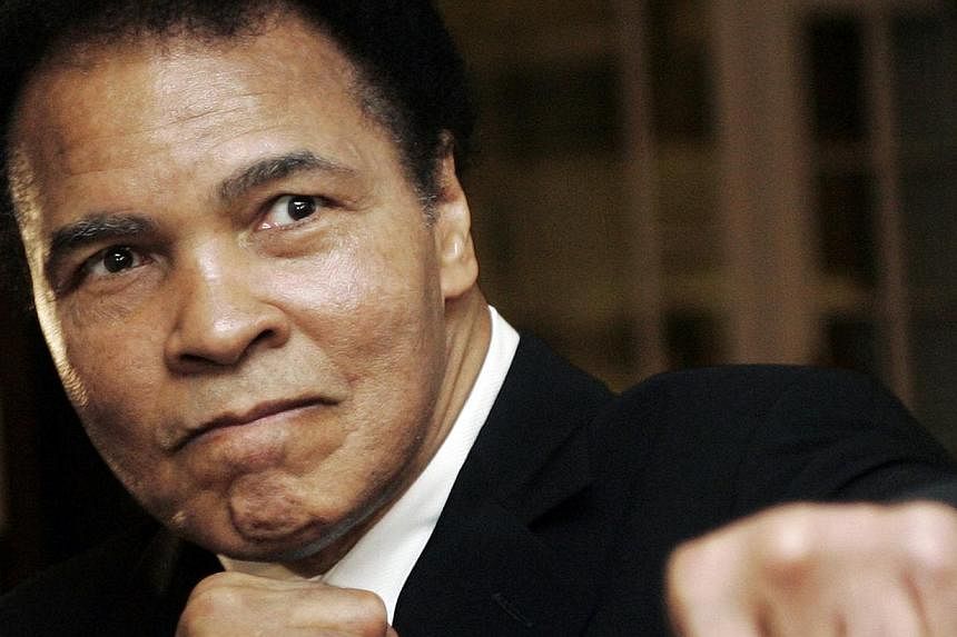 U.S. boxing great Muhammad Ali poses during the Crystal Award ceremony at the World Economic Forum (WEF) in Davos, Switzerland in this Jan 28, 2006 file photo. -- PHOTO: REUTERS