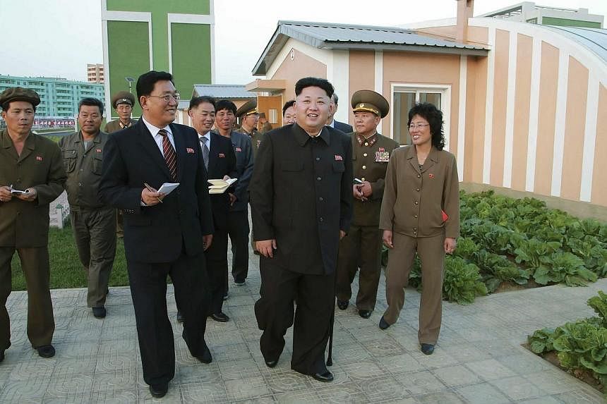 North Korean leader Kim Jong Un is pictured (centre) in an undated photo released Oct 14, 2014.&nbsp;North Korea called on Saturday for a joint investigation with the US into a crippling cyber attack on Sony Pictures, denouncing Washington's "slander
