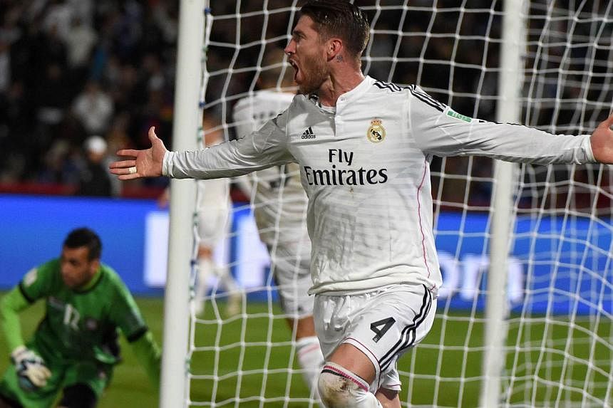 Real Madrid's defender Sergio Ramos scored the first goal with a thumping header from a corner. -- PHOTO: AFP