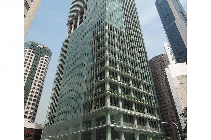 The building's energy-efficient double-skin façade comprises a primary curtain wall of glass and secondary layer of teeming planters that cuts solar heat gain by up to 26%. -- PHOTO: CAPITALAND