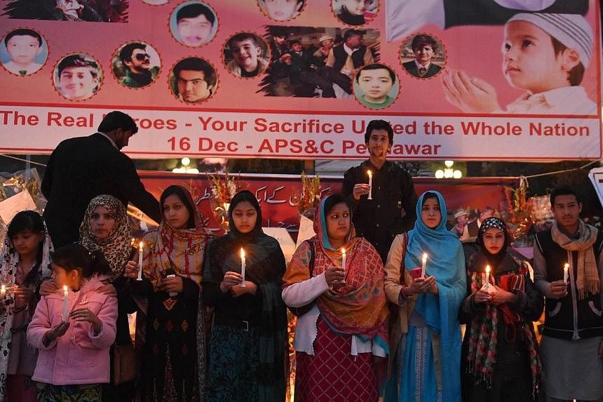 Pakistani demonstrators light candles during a vigil for victims of the Peshawar school massacre in Quetta on Dec 21, 2014.&nbsp;Pakistan plans to execute around 500 militants in coming weeks, officials said Monday, after the government lifted a mora