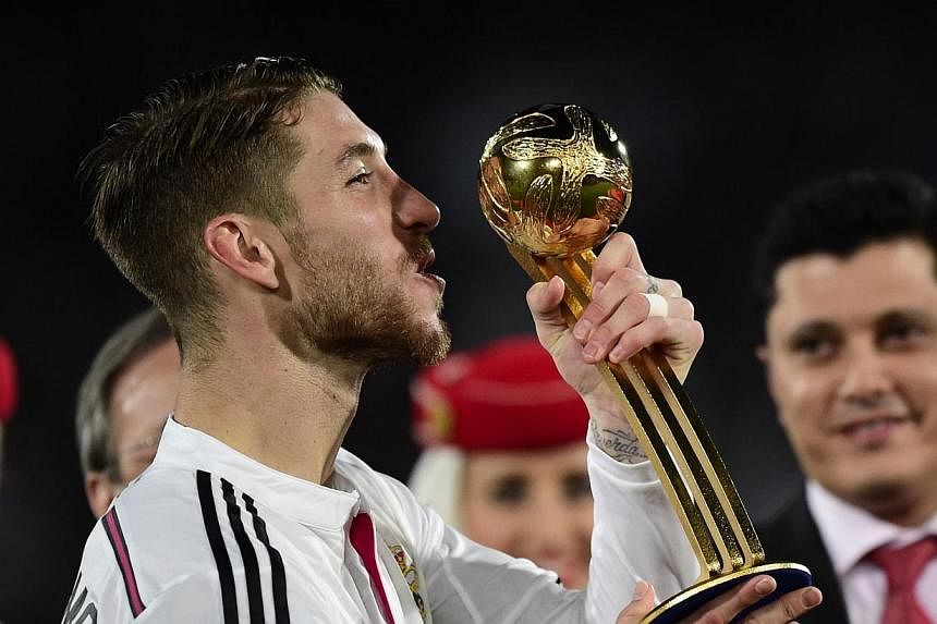 Real Madrid's defender Sergio Ramos poses with the trophy of the best player at the end of the FIFA Club World Cup final football match against San Lorenzo at the Marrakesh stadium in the Moroccan city of Marrakesh on Dec 20, 2014.&nbsp;Decorated Rea