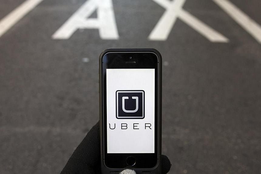 Taiwan's transport ministry said Uber Technologies Inc is operating a taxi-hailing service "in violation of the law", and that it is investigating the possibility of blocking access to the US company's website and mobile app. -- PHOTO: REUTERS