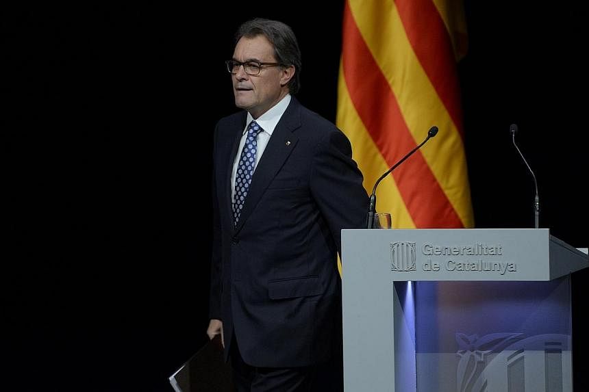 Catalonia's High Court said on Monday, Dec 22, 2014, that it would open proceedings over the alleged disobedience of regional President Artur Mas and other local leaders for holding a symbolic vote on independence from Spain in November. -- PHOTO: AF