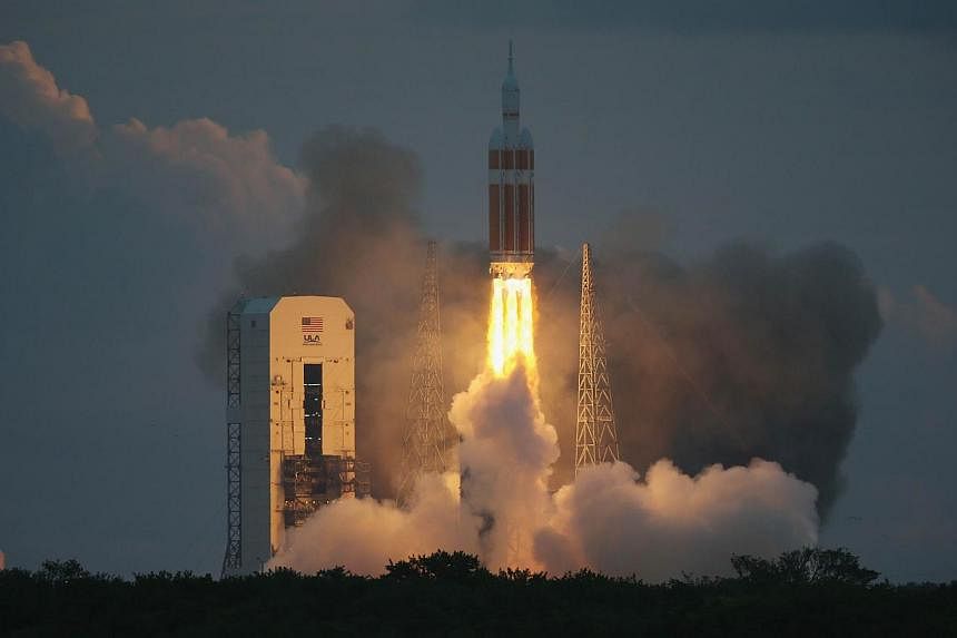 The United Launch Alliance Delta 4 rocket carrying NASA's first Orion deep space exploration craft takes off from its launchpad&nbsp;&nbsp;in Cape Canaveral, Florida&nbsp;on Dec 5, 2014. -- PHOTO: AFP