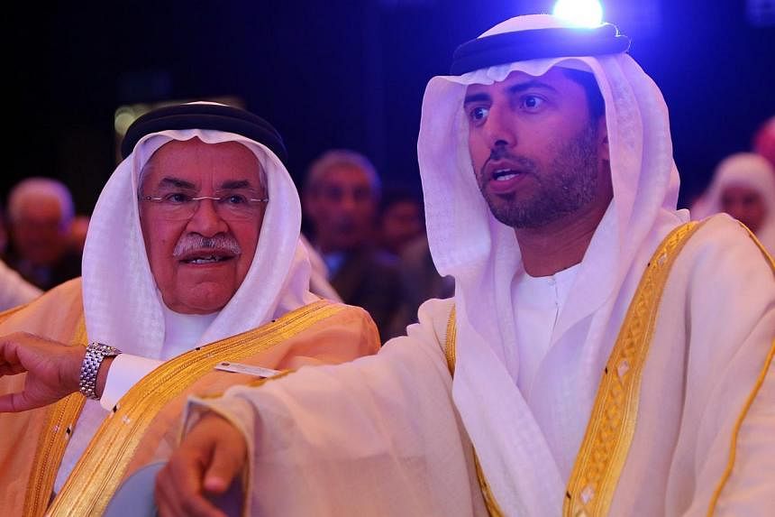 Saudi Oil Minister Ali al-Naimi (centre) with United Arab Emirates Energy Minister Suhail &nbsp;al-Mazrouei (right) during the opening session of the 10th Arab Energy Conference in Abu Dhabi on Dec 21, 2014. Mr Naimi, the de facto leader of the Organ