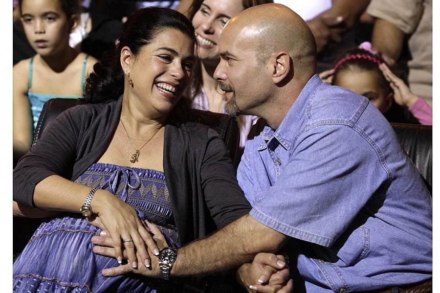 Mr Gerardo Hernandez and his wife, Ms Adriana Perez, are expecting his baby in two weeks, even though he was locked up for 16 years without conjugal visits. It will be a girl called Gema, Cuban official media said. -- PHOTO: REUTERS