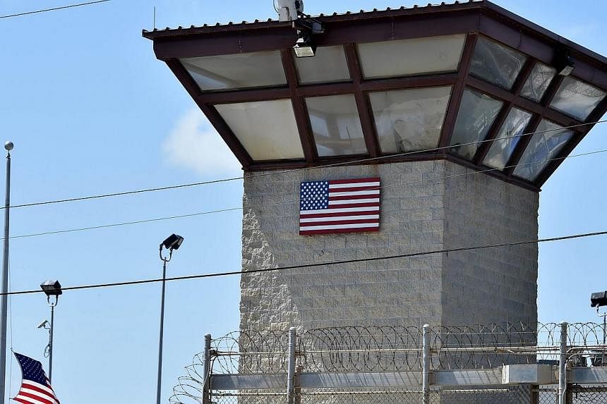 This April 8, 2014 file photo made during an escorted visit and reviewed by the US military shows the razor wire-topped fence and the watch tower of "Camp 6" detention facility at the US Naval Station in Guantanamo Bay, Cuba.&nbsp;The US official res