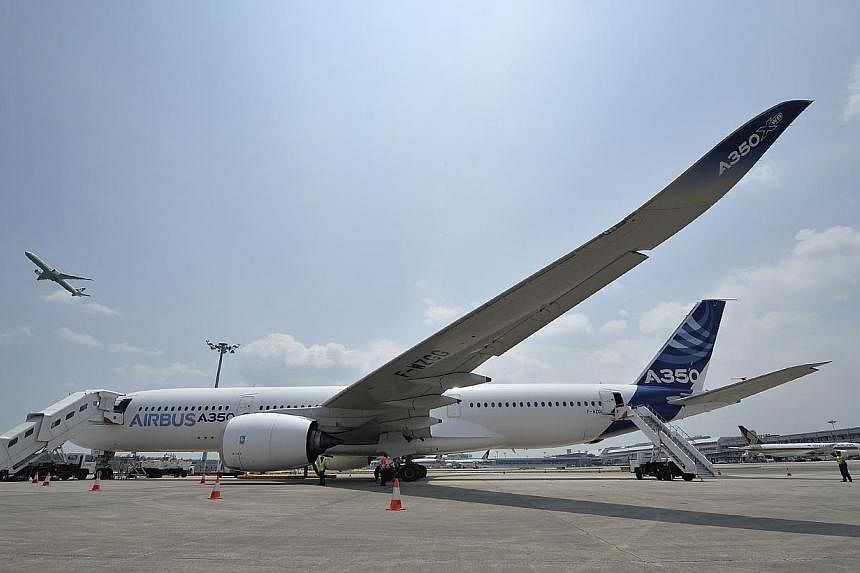The A-350 (pictured) competes head-on with Boeing’s 787 Dreamliner. -- PHOTO: ST FILE