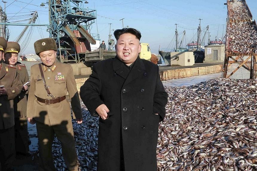 North Korea's leader Kim Jong Un visiting a Korean People's Army fishery station in Pyongyang in an undated photo released by the Korean Central News Agency. -- PHOTO: REUTERS