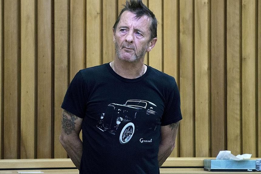 Phil Rudd faces charges of threatening to kill and drug possession in New Zealand and fellow band members, including guitarist Angus Young, have hinted he will be dropped for AC/DC's upcoming world tour. -- PHOTO: AFP