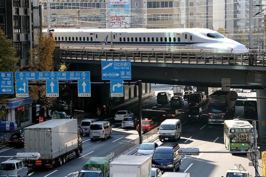 A Shinkansen bullet train passes over a road in Tokyo on Dec 8, 2014.&nbsp;Japan, fearing it could be a soft target for possible North Korean cyberattacks in the escalating row over the Sony Pictures hack, has begun working to ensure basic infrastruc