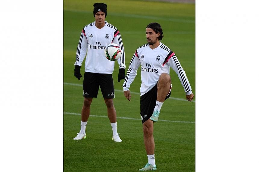 Real Madrid's German midfielder Sami Khedira (right) takes part in a training session at Crown Prince Moulay el-Hassan Stadium in Rabat on Dec 15, 2014, on the eve of his Club World Cup semi final football match against Mexico's Cruz Azul FC. --PHOTO