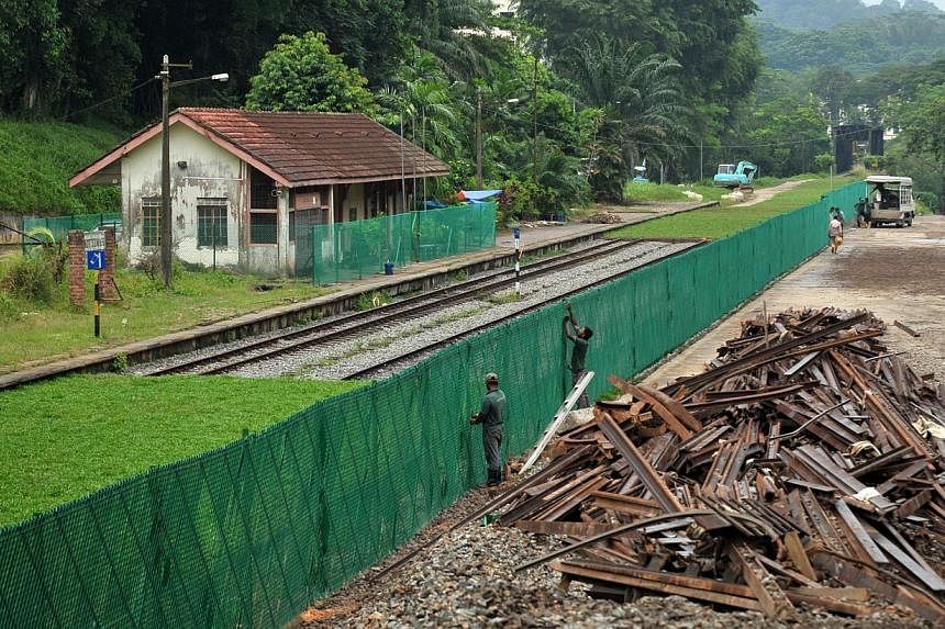 Track removal work progresss at the KTM Bukit Timah railway station. Experts believe that the distance between Singapore and Kuala Lumpur is ideal for a high-speed rail. --STPHOTO: ALPHONSUS CHERN&nbsp;