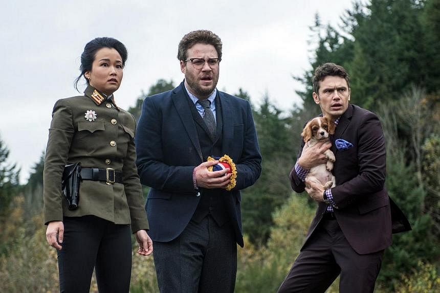 The Interview stars Seth Rogen (centre) and James Franco (right), shown here in a cinema still from The Interview with Diana Bang, hailed Sony's reversal of its original decision to cancel the film's showing and to allow its limited release on Thursd