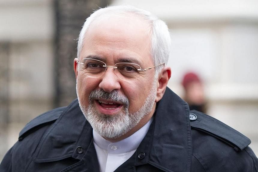 Iranian Foreign Minister Mohammad Javad Zarif (above) said on Wednesday that he is confident that a lasting agreement can be struck with world powers over his country's disputed nuclear programme. -- PHOTO: AFP