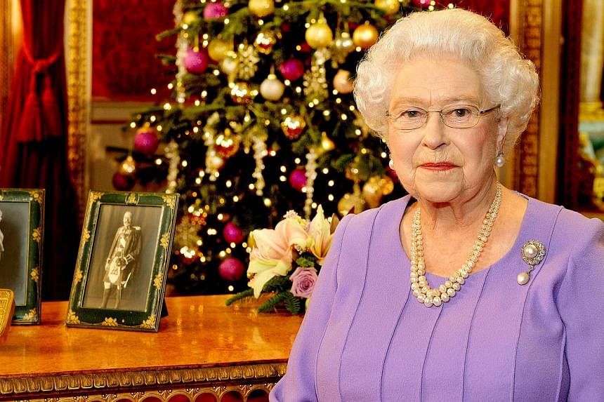 Britain's Queen Elizabeth II is pictured after recording her Christmas Day broadcast to the Commonwealth, in the State Dining Room at Buckingham Palace in central London, on Dec 10, 2014. -- PHOTO: AFP&nbsp;