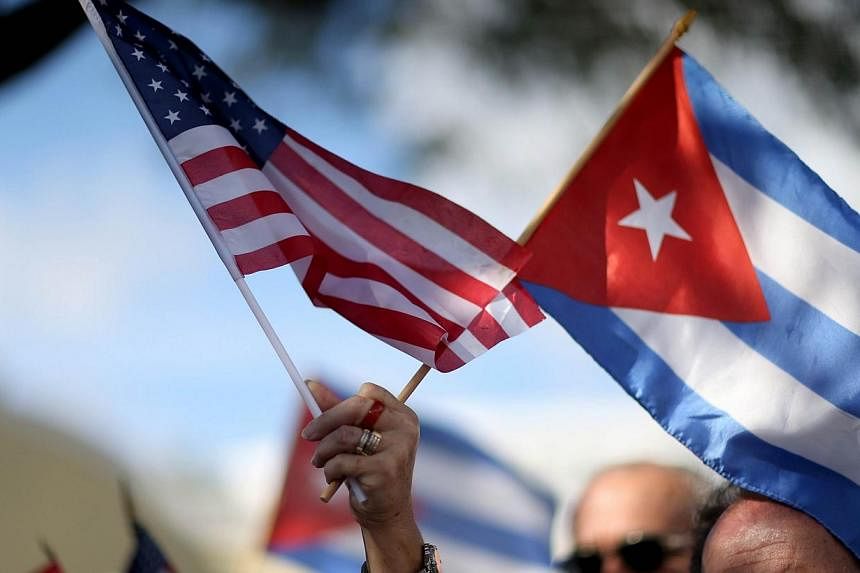 Cuban expatriates in America, including many who risked their lives to escape the communist island, are torn about whether to return after Havana and Washington formally reestablish ties next year. -- PHOTO: AFP