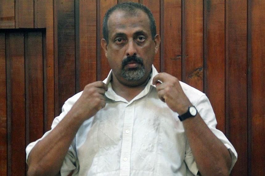 Kenyan national Feisal Mohammed Ali stands in the dock at a Mombasa court on Dec 24, 2014, after being handed over by Tanzanian authorities. -- PHOTO: AFP